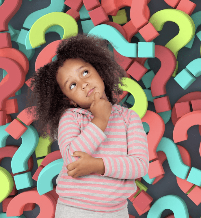 Girl pondering amidst question marks.
