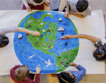 Here's an alt tag for the image: Children collaboratively paint a world map.