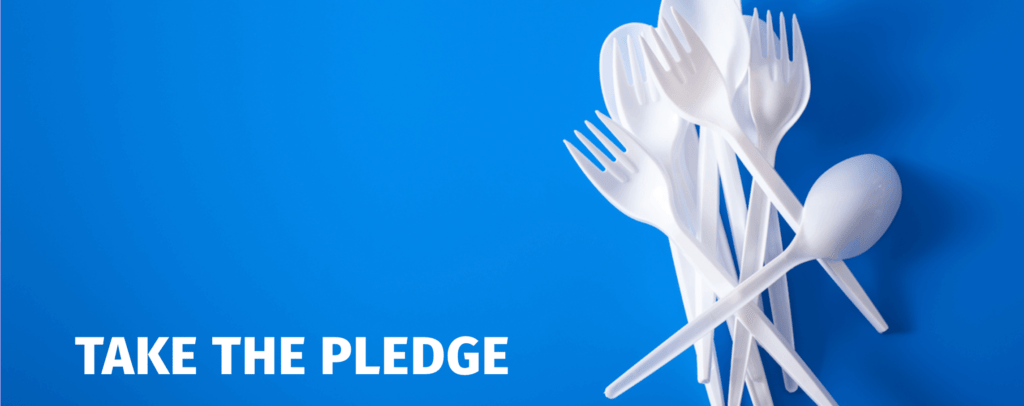 White plastic cutlery on blue background.